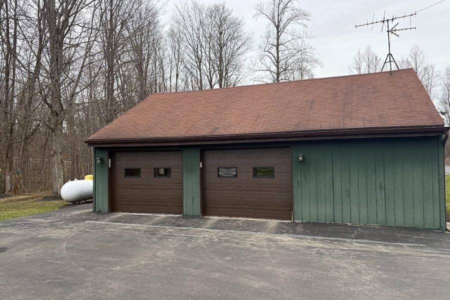 When a garage door starts acting differently in Manchester, it usually does not happen without a reason. It shows up as a door that sticks after a cold night, sounds louder than it used to, or does not close evenly anymore.