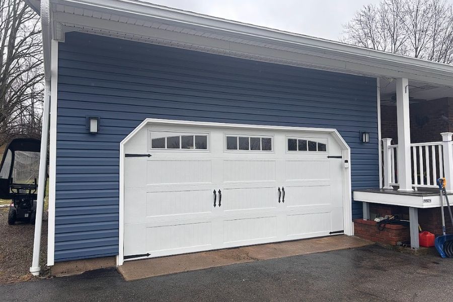 Garage doors in North Rose work harder than many homeowners expect. Between lake-effect snow from Lake Ontario, agricultural dust from nearby orchards, and the everyday use that comes with rural living, garage doors here tend to experience wear patterns that show up earlier than people anticipate.