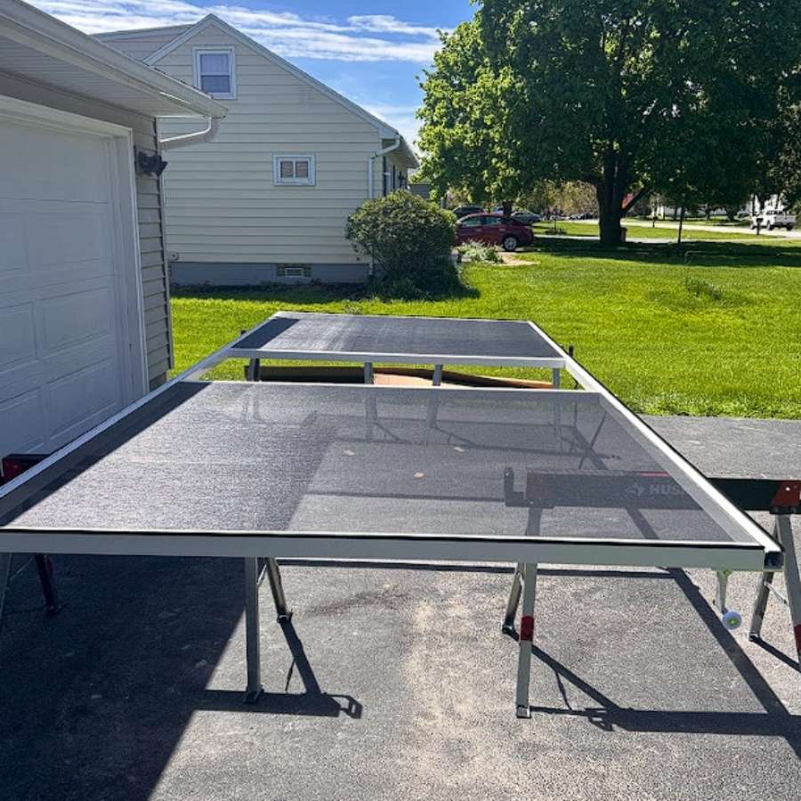 Garage door windows add weight to the door sections, particularly when tempered or insulated glass is used instead of lightweight acrylic inserts.